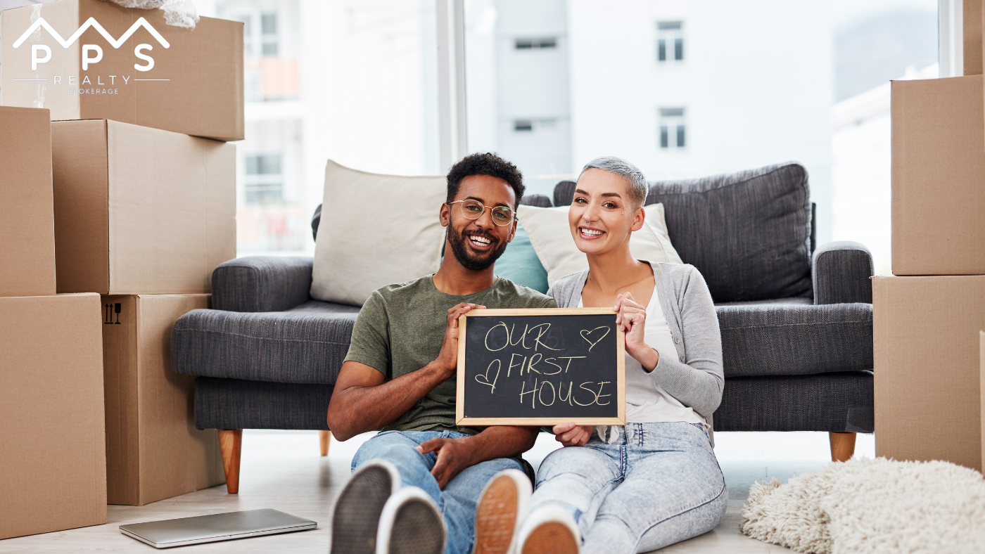 first-time buyers sitting in their new house with boxes