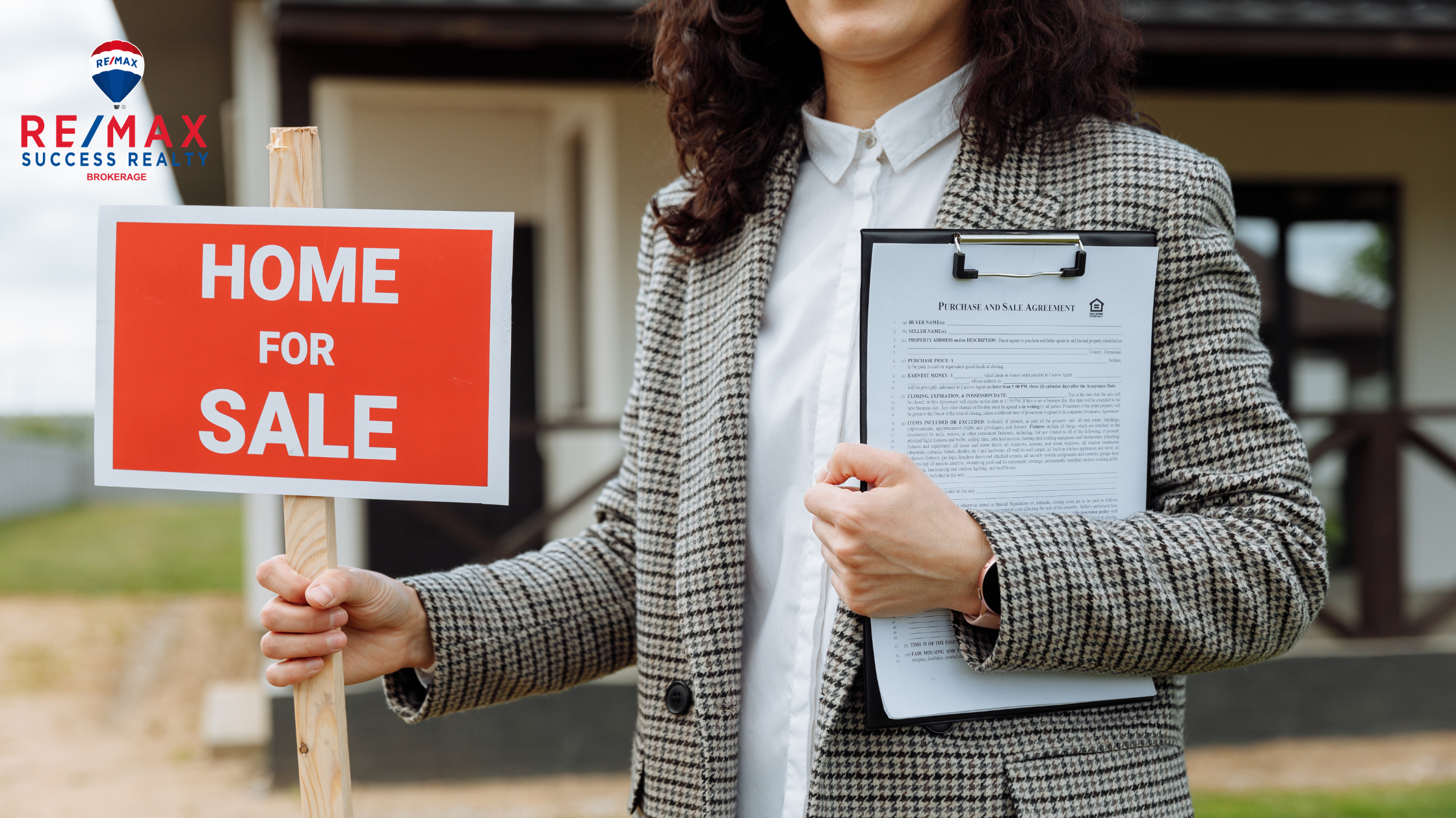home for sale sign with agent holding a clipboard in other hand