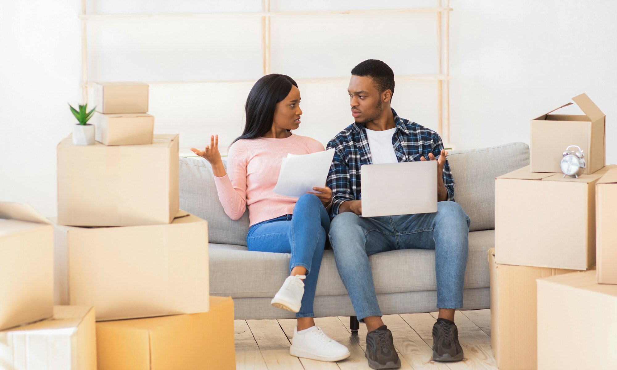 Young family finding moving mistakes when purchasing their house