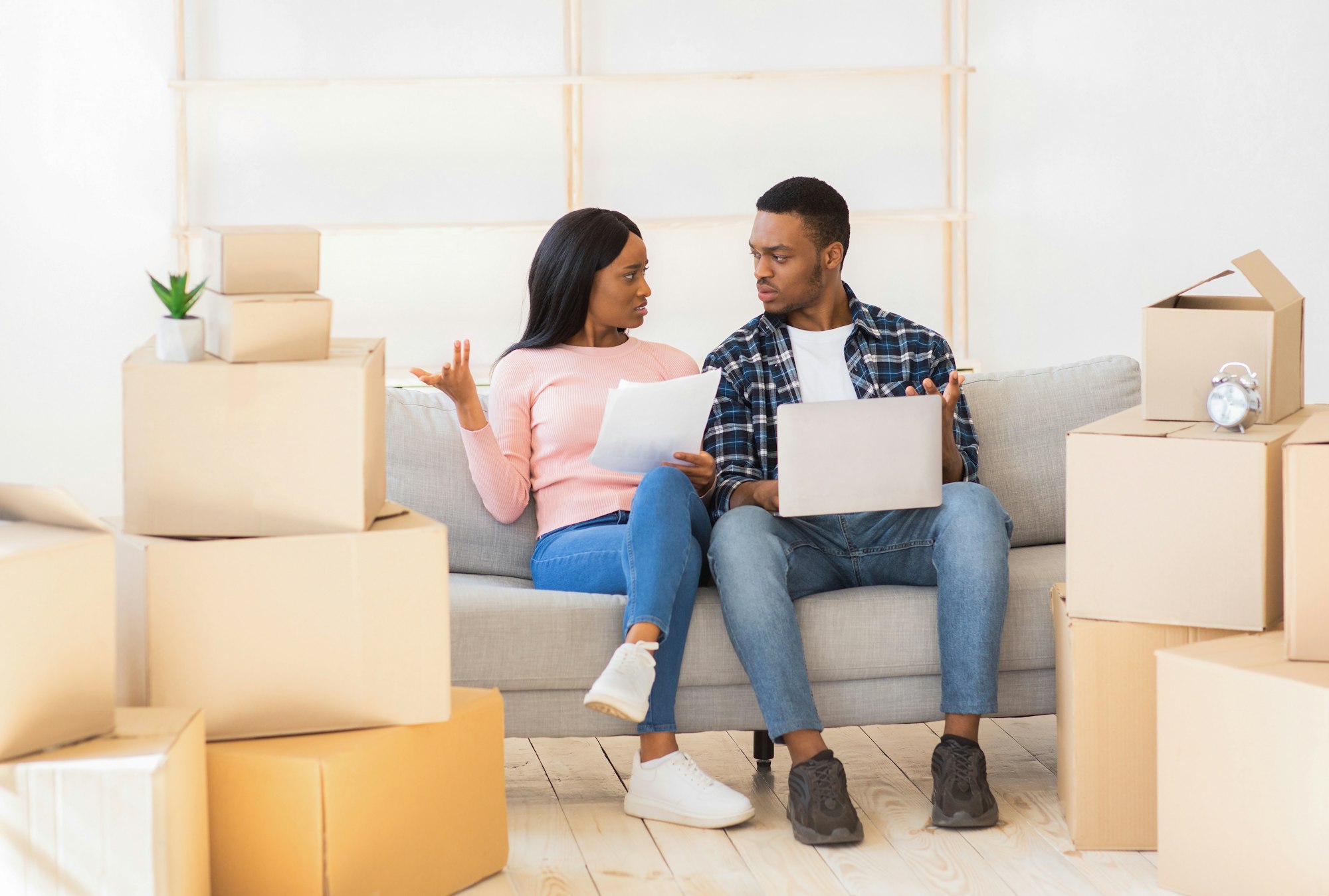 Young family finding moving mistakes when purchasing their house